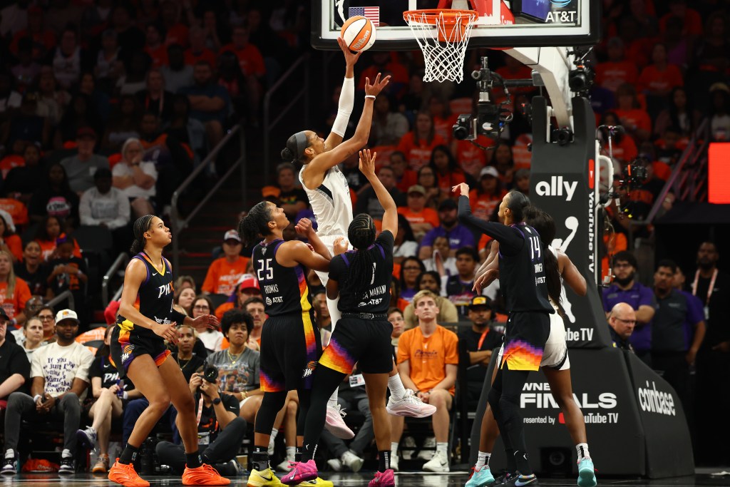 Las Vegas Aces center A'ja Wilson scores a layup over multiple Phoenix Mercury defenders, including Alyssa Thomas, who was dealing with foul trouble.