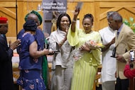 During a service celebrating her retirement, senior pastor the Rev. Sheron Patterson waves a...