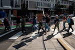 Members of the Portland State University Faculty Association, which represents adjunct faculty, along with students and other supporters march through Portland State University campus in downtown Portland, Ore., on Thursday, Oct. 16, 2025.