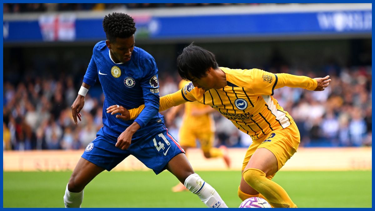Estevao Willian takes on Mitoma. (Photo by Clive Mason/Getty Images)