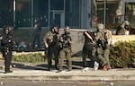 Federal officers arrest a protester outside the ICE facility in SW Portland. Earlier on, a small group of demonstrators broke through the front door to the building, June 14, 2025.