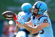 Arlington Renegades receiver David Durden (85) pulls in a reception during the team's...