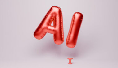 An "AI" balloon floating close to a sharp, upturned push pin.