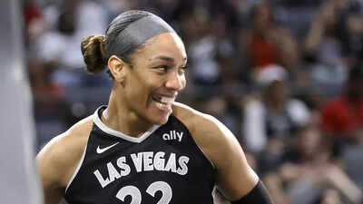 A’ja Wilson. Image via: Steve Marcus/Las Vegas Sun via AP A’ja Wilson celebrates with '400 Degreez' rapper after Las Vegas Aces’ Game 1 blowout over Phoenix Mercury