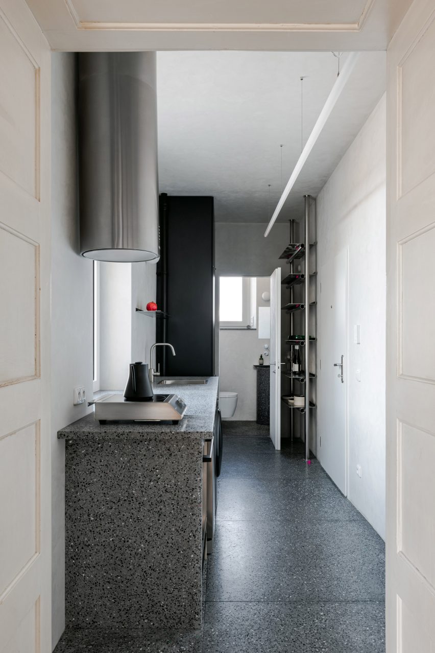 View into kitchen and bathroom beyond