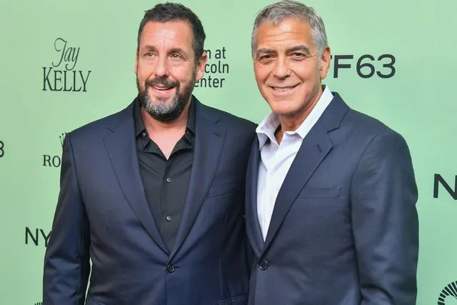 Stephen Lovekin/Shutterstock Adam Sandler and George Clooney