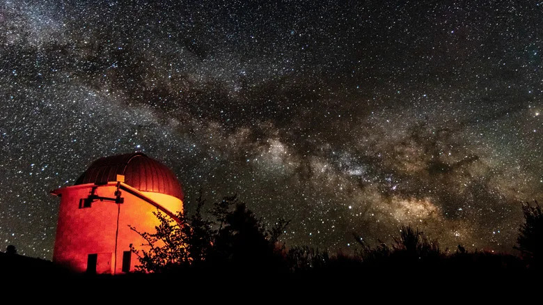 A mountain observatory underneath the night sky