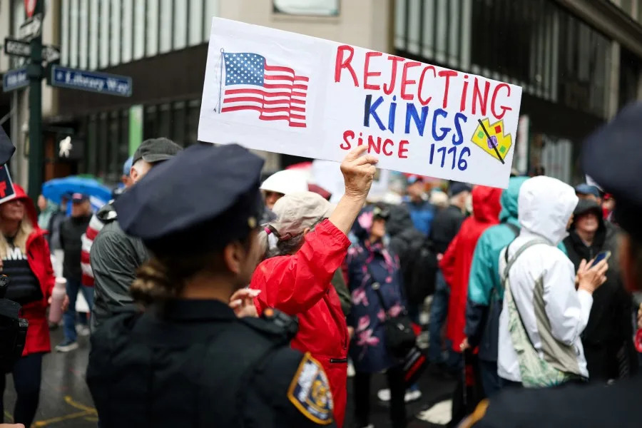 People take part in a “No Kings” protest in New York on June 14, 2025 as US President Donald Trump presides over a military parade in Washington, DC. Trump will preside over a huge military parade in Washington on his 79th birthday, as nationwide protests rejecting his brand of politics underscore deep divisions over his second term. But the threat of thunderstorms in the US capital, and the barrage of missiles raining down in Tel Aviv and Tehran — a conflict in which the American military is assisting — could cast a long shadow over the president’s celebration. Nearly 7,000 troops plus dozens of tanks and helicopters will rumble through Washington in an event officially marking the 250th anniversary of the US army — at a cost of up to $45 million. (Photo by CHARLY TRIBALLEAU / AFP) (Photo by CHARLY TRIBALLEAU/AFP via Getty Images)