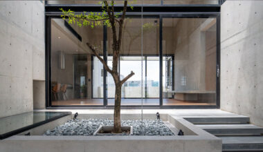 green courtyard anchors hybrid home and office in bangkok