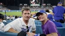 LOS ANGELES, CA - OCTOBER 28: Brad Pitt and Flea pose for a photo during Game Four of the 2025 World Series presented by Capital One between the Toronto Blue Jays and the Los Angeles Dodgers at Dodger Stadium on Tuesday, October 28, 2025 in Los Angeles, California. (Photo by Emma Sharon/MLB Photos via Getty Images)
