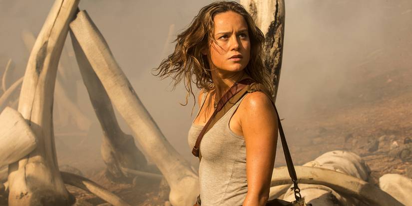 Brie Larson looking at the bones on the island in as Mason Weaver In Kong Skull Island.