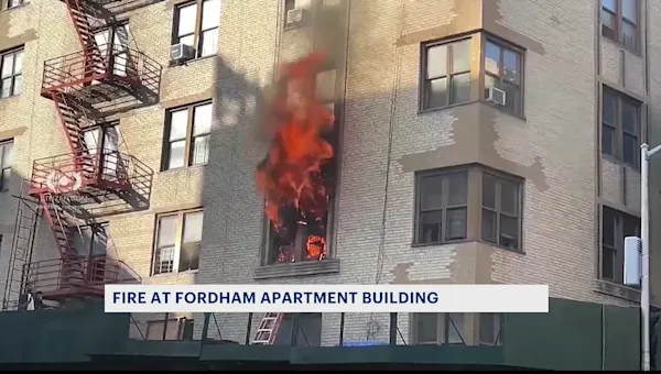 Citizen video shows child rescued from Fordham blaze that left 12 people injured