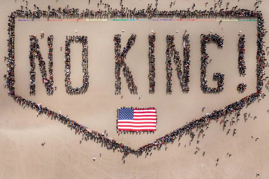 People form a human banner at Ocean Beach during the “No Kings” protests in San Francisco on Saturday, June 14, 2025. (Santiago Mejia/San Francisco Chronicle via AP)