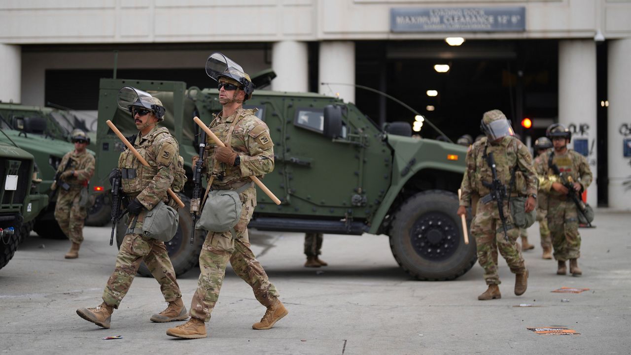 U.S. National Guard are deployed around downtown Los Angeles, Sunday, June 8, 2025, following an immigration raid protest the night before. (AP Photo/Eric Thayer)