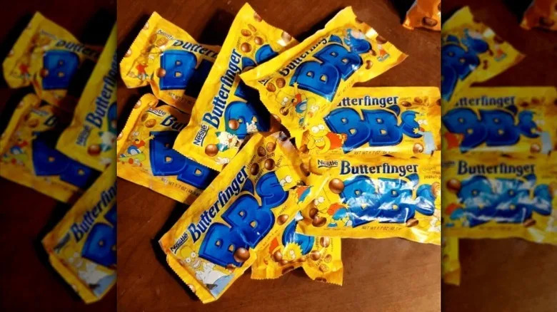 a pile of Butterfinger BB's on a wooden table