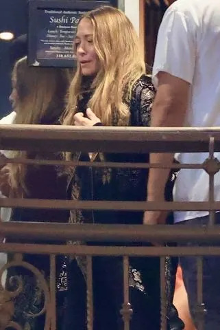 BACKGRID Mary-Kate Olsen bundles up in an oversize scarf and all-black look for rare outing in Los Angeles on October 21, 2025