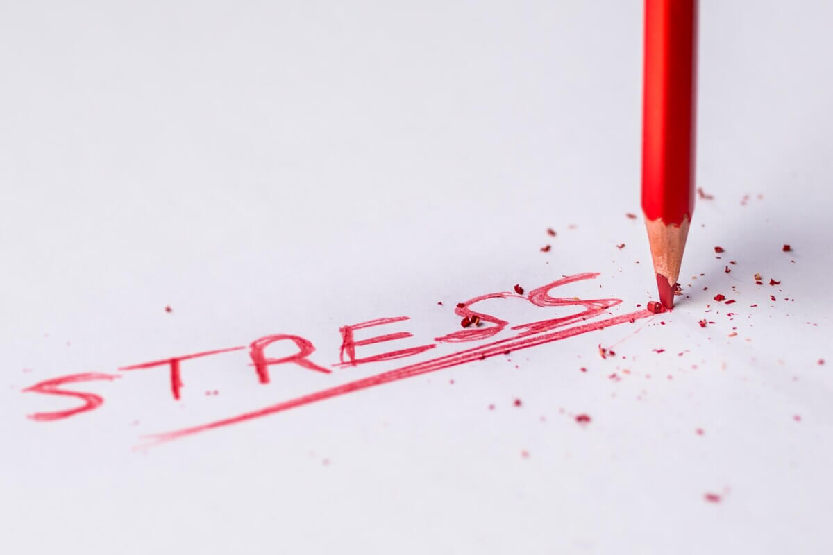 Stress written on notepad in red pencil