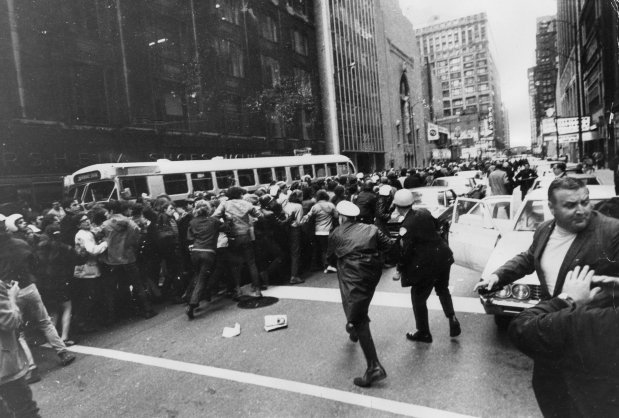 Chicago police and the SDS Weathermen clash near the intersection of LaSalle and Madison streets in Chicago in October 1969. (Chicago Tribune historical photo)