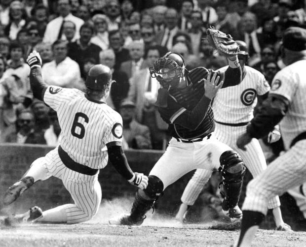 Even Keith Moreland, not known as a sprinter, has the Cubs' running spirit in the third inning on Oct. 3, 1984. On Ron Cey's double, Moreland roared all the way around from first base, sliding home with the second run of the game while shortstop Garry Templeton's relay throw skipped away from Padre's catcher Terry Kennedy. (Bob Fila/Chicago Tribune)