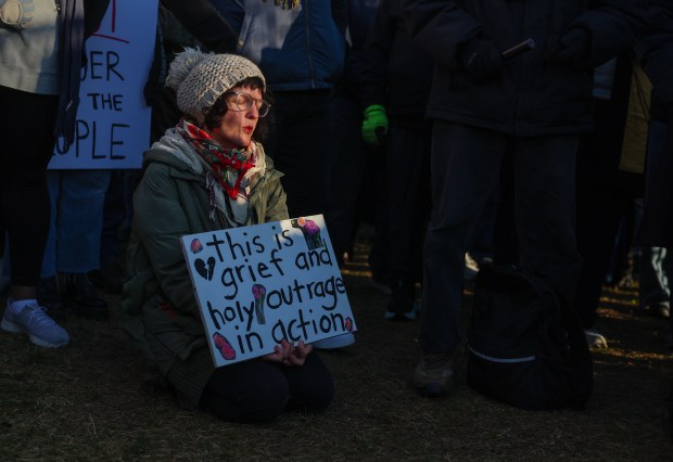 Sarah Schroeder, of Chicago, sings during an interfaith prayer service led by the North Shore Unitarian Church outside of the U.S. Immigration and Customs Enforcement holding facility in Broadview on Oct. 24, 2025. (Stacey Wescott/Chicago Tribune)