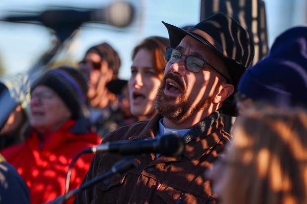 The Rev. Lucas Hergert sings during an interfaith prayer service led by the North Shore Unitarian Church outside of the U.S. Immigration and Customs Enforcement holding facility in Broadview on Oct. 24, 2025.  (Stacey Wescott/Chicago Tribune)