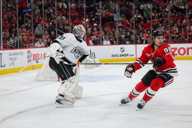 Chicago Blackhawks center Connor Bedard (98) watches Los Angeles Kings goaltender Anton Forsberg (31) flint the puck into the stands during the first period at the United Center Sunday Oct. 26, 2025 in Chicago. (Armando L. Sanchez/Chicago Tribune)