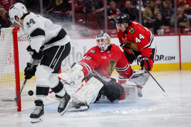 Chicago Blackhawks goaltender Arvid Soderblom (40) blocks a shot from Los Angeles Kings right wing Alex Laferriere (14) during the second period at the United Center Sunday Oct. 26, 2025 in Chicago. (Armando L. Sanchez/Chicago Tribune)