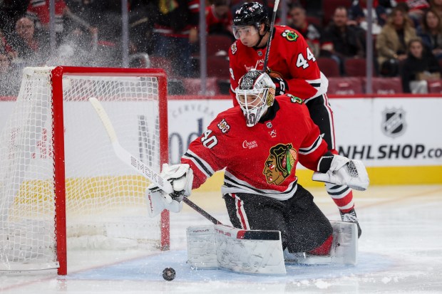 Chicago Blackhawks goaltender Arvid Soderblom (40) blocks a shot from Los Angeles Kings right wing Alex Laferriere (14) during the second period at the United Center Sunday Oct. 26, 2025 in Chicago. (Armando L. Sanchez/Chicago Tribune)