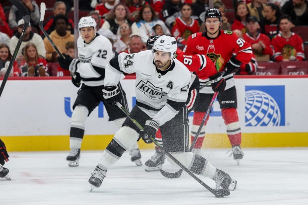 Los Angeles Kings center Phillip Danault (24) takes a shot during the second period against the Chicago Blackhawks at the United Center Sunday Oct. 26, 2025 in Chicago. (Armando L. Sanchez/Chicago Tribune)