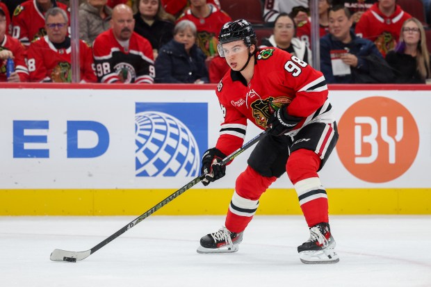 Chicago Blackhawks center Connor Bedard (98) handles the puck during the first period against the Los Angeles Kings at the United Center Sunday Oct. 26, 2025 in Chicago. (Armando L. Sanchez/Chicago Tribune)