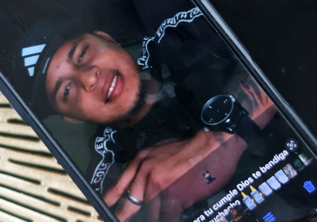 A photo of Darwin Leal is displayed on his wife's phone, Sept. 23, 2025. (Terrence Antonio James/Chicago Tribune)