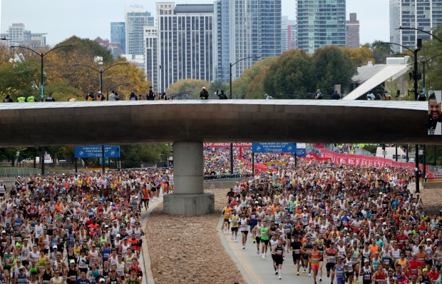 Thousands of runners head north on Columbus Avenue in Grant Park to start the Chicago Marathon on Oct. 13, 2024. (Tess Crowley/Chicago Tribune)