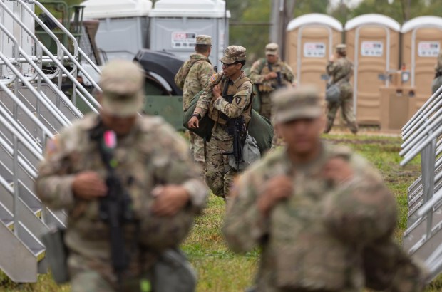 Members of the Texas National Guard arrive on Oct. 7, 2025, at the Army Reserve Training Center in Elwood. (Brian Cassella/Chicago Tribune)