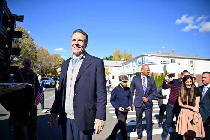 Cuomo stumps in Queens to rally with Jewish New Yorkers in support of Israel 3 man in a blue suit surrounded by people outside