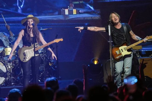 Amy E. Price/Getty Maggie Baugh and Keith Urban perform during the iHeartCountry Festival on May 4, 2024, in Austin, Texas.