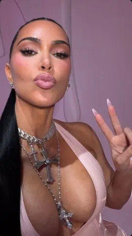 Instagram/Kim Kardashian Kim Kardashian in a plunging latex dress at Kylie Jenner's cosmetics party on October 18