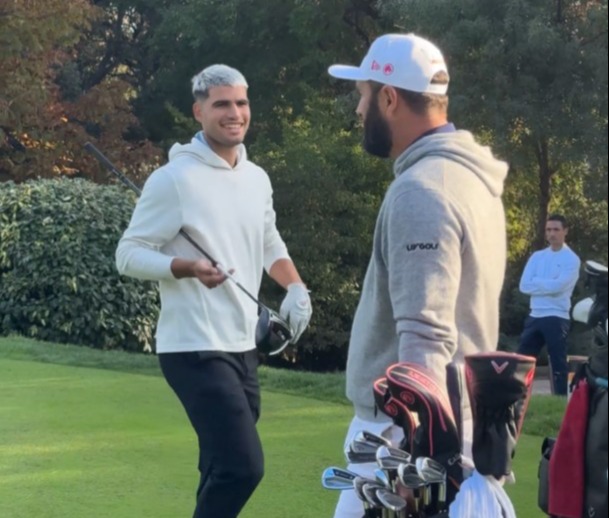 The tennis star wore a huge smile as he went over Rahm afterwards