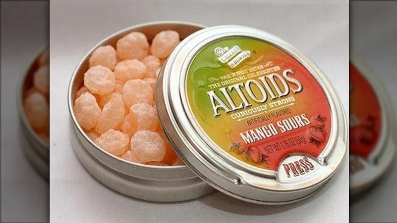 an open container of Altoids sours in mango flavor