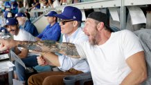 LOS ANGELES, CA - OCTOBER 28: Chris Pine and Dax Sheppard react in the suite during Game Four of the 2025 World Series presented by Capital One between the Toronto Blue Jays and the Los Angeles Dodgers at Dodger Stadium on Tuesday, October 28, 2025 in Los Angeles, California. (Photo by Emma Sharon/MLB Photos via Getty Images)