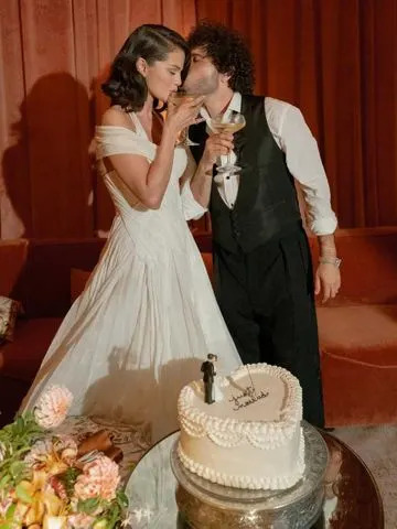 Courtesy of Selena Gomez's Instagram Selena Gomez and Benny Blanco toast at their wedding.