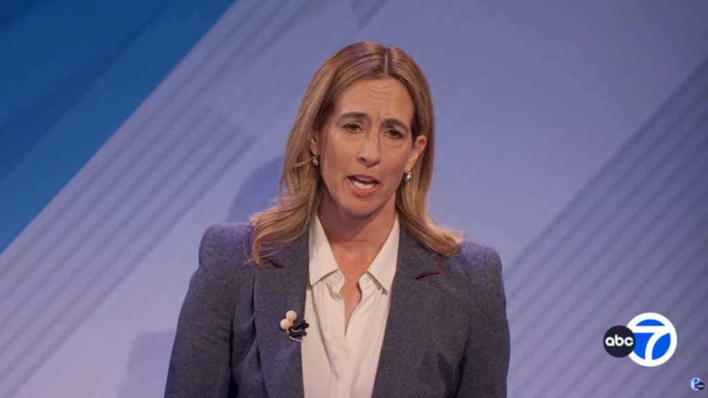 Mikie Sherrill speaking at a debate.