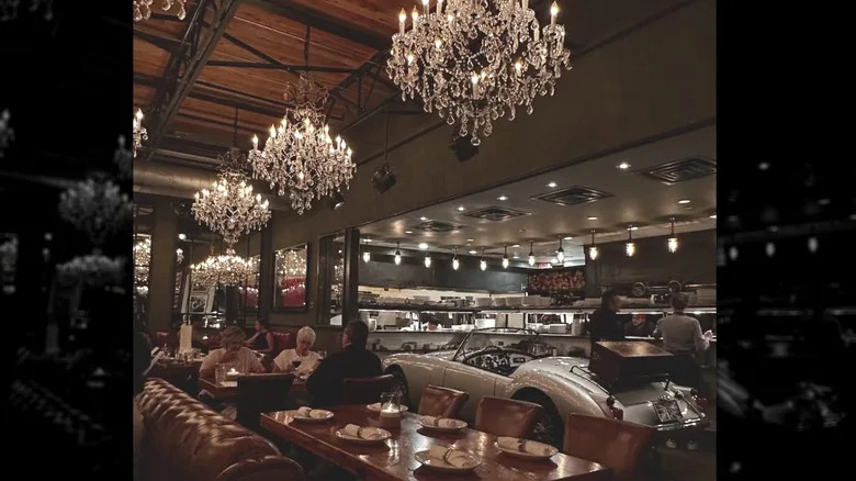 Chandeliers and tables in interiors of Town Hearth