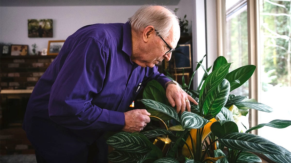 Doug Whitney watering plants