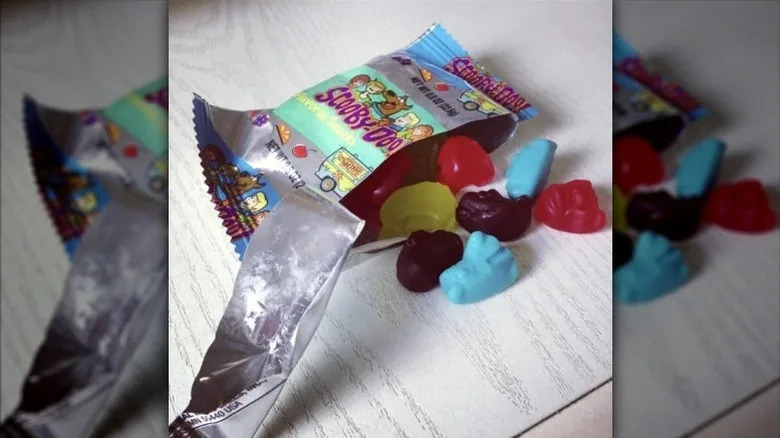 Open package of Scooby-Doo fruit snacks featuring two of the opaque blue gummies