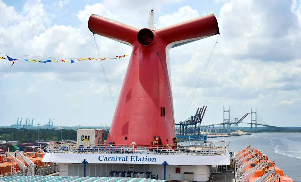 Bob.Self@jacksonville.com--5/2/16--The main stack of the Carnival Elation with the Dames Point Bridge and Jacksonville's port facilities in the background. The Carnival cruise ship Elation has started cruise service from JAXPORT's cruise terminal, replacing the Fascination on the 4 and 5 day Bahamian cruises. Photographed May 2, 2016.  (The Florida Times-Union/Bob Self)