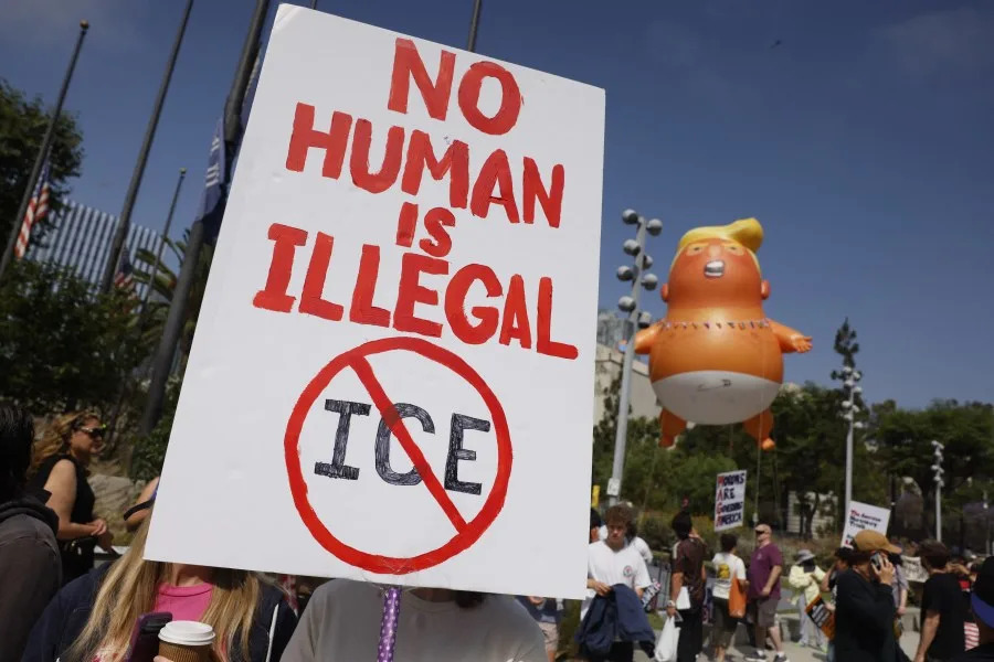 Demonstrators gather to protest the Trump administration during the “No Kings” rally in downtown Los Angeles on June 14, 2025, on the same day as President Trump’s military parade in Washington, DC. In response to the military parade celebrating the 250th anniversary of the US Army but also coinciding with Trump’s 79th birthday, a “No Kings” movement has sprung up promising to stage protests in more than 2,000 places across the country, including a large parade expected in Los Angeles which organizers say will feature a “20-foot-tall balloon of Trump wearing a diaper.” (Photo by Etienne LAURENT / AFP) (Photo by ETIENNE LAURENT/AFP via Getty Images)