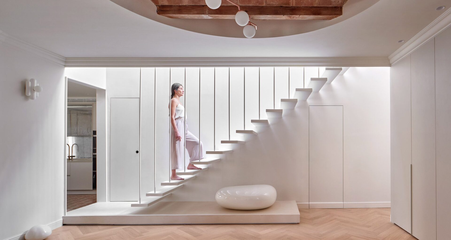 Interior of flat with white staircase