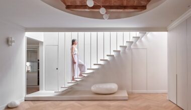 Interior of flat with white staircase