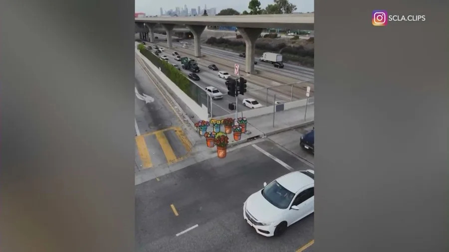 Illustrations of scattered supplies belonging to street vendors, landscapers, and construction workers are seen sitting abandoned over real video, portraying the impact the recent ICE raids have had in local communities. (SCLA.Clips)