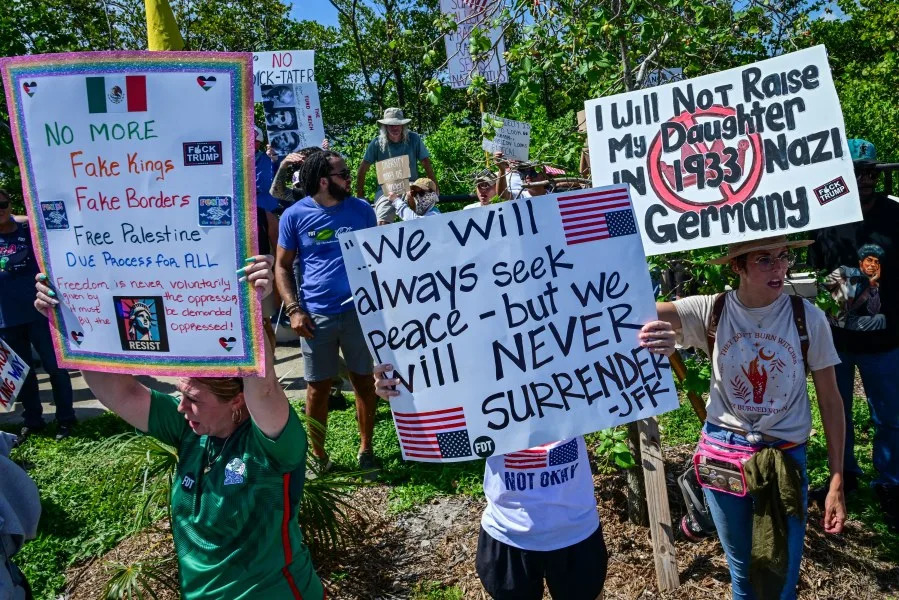 EDITORS NOTE: Graphic content / Demonstrators protest against the Trump administration during the “No Kings” rally near US President Donald Trump’s Mar-a-Lago home in West Palm Beach, Florida, on June 14, 2025. In response to the military parade celebrating the 250th anniversary of the US Army, coinciding with Trump’s 79th birthday, a “No Kings” movement has sprung up promising to stage protests in more than 2,000 places across the country, including a large parade expected in Los Angeles which organizers say will feature a “20-foot-tall balloon of Trump wearing a diaper.” (Photo by Giorgio Viera / AFP) (Photo by GIORGIO VIERA/AFP via Getty Images)